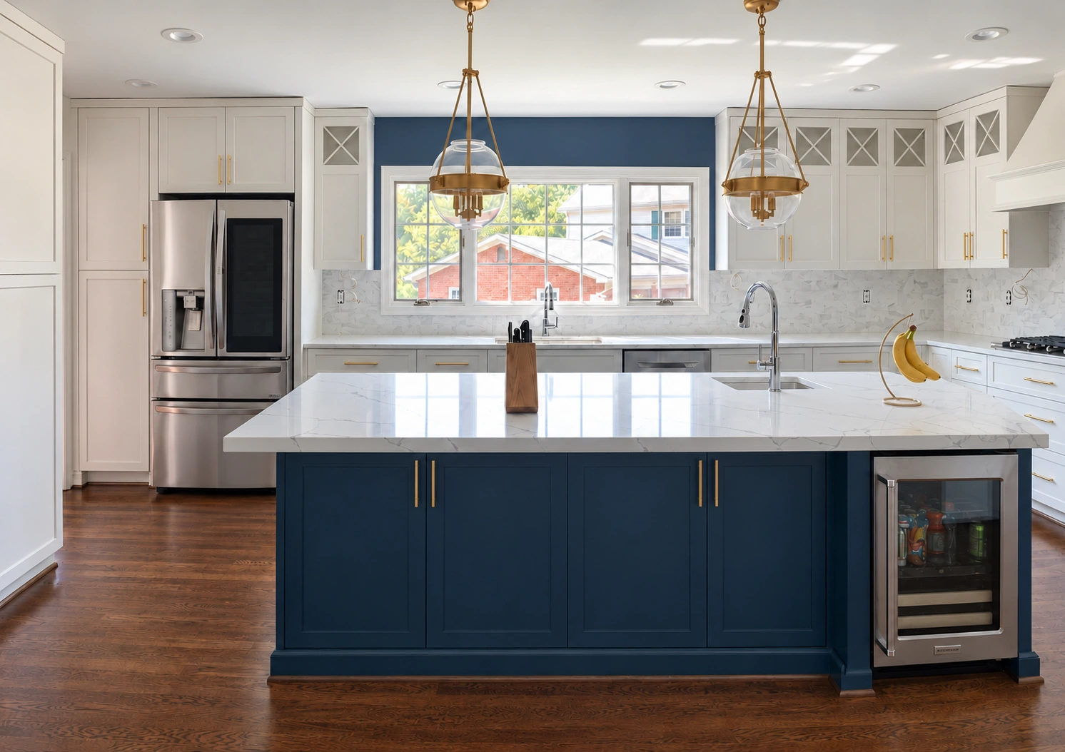 Kitchen with a navy island and accent wall, featuring CHI drywall and painting work